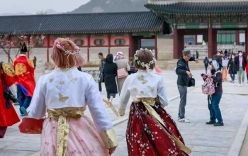 Asian Korean woman dressed Hanbok in traditional dress walking in Gyeongbokgung Palace