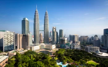 Aerial view of Petronas Twin Towers and KLCC Park in Kuala Lumpur, Malaysia – ideal area for travellers searching for a hotel near KLCC.