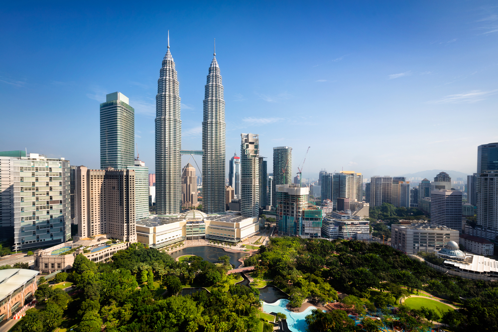 Aerial view of Petronas Twin Towers and KLCC Park in Kuala Lumpur, Malaysia – ideal area for travellers searching for a hotel near KLCC.