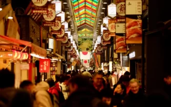 kyoto-japan-january-2-2025-nishiki Crowds exploring Nishiki Market in Kyoto, a bustling food and souvenir street easily accessible from a Kyoto hotel near the city centre.