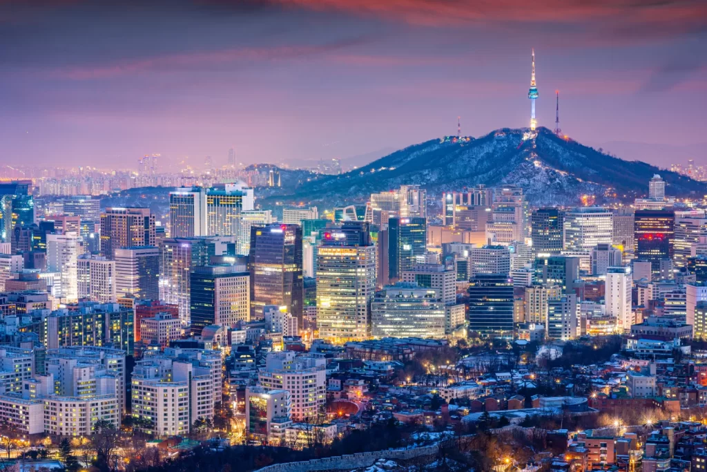 Seoul city skyline at dusk with Namsan Tower, a popular view near a korea hotel and part of top Seoul night attractions.