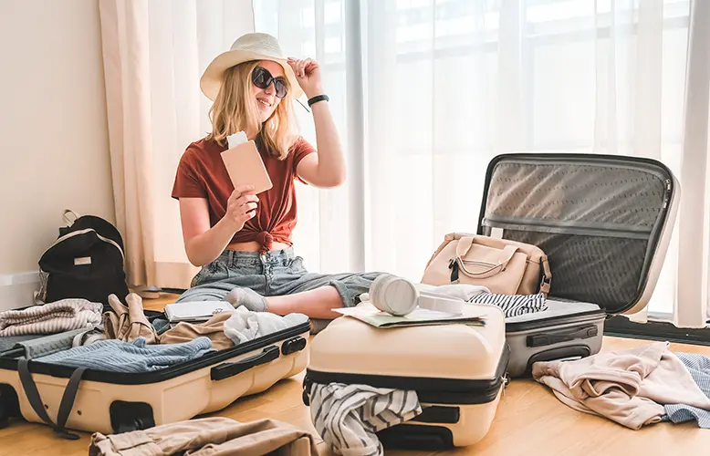 Young traveller packing suitcases for an extended trip, preparing to enjoy a Seoul long stay package.