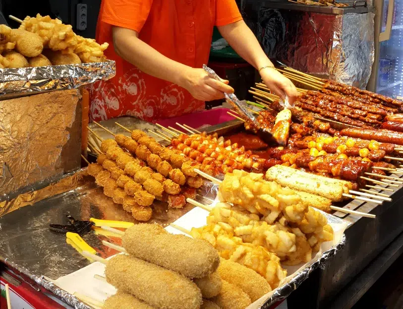 different Korean street food being sold in Myeongdong, South Korea